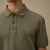 Polo à manches courtes en piqué 24/1 teint à la pigmentation