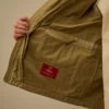 Veste en sergé avec fermeture à glissière pour les lunettes de soleil